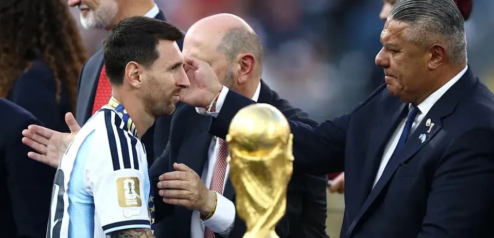 Lionel Messi receiving trophy after match ceremony