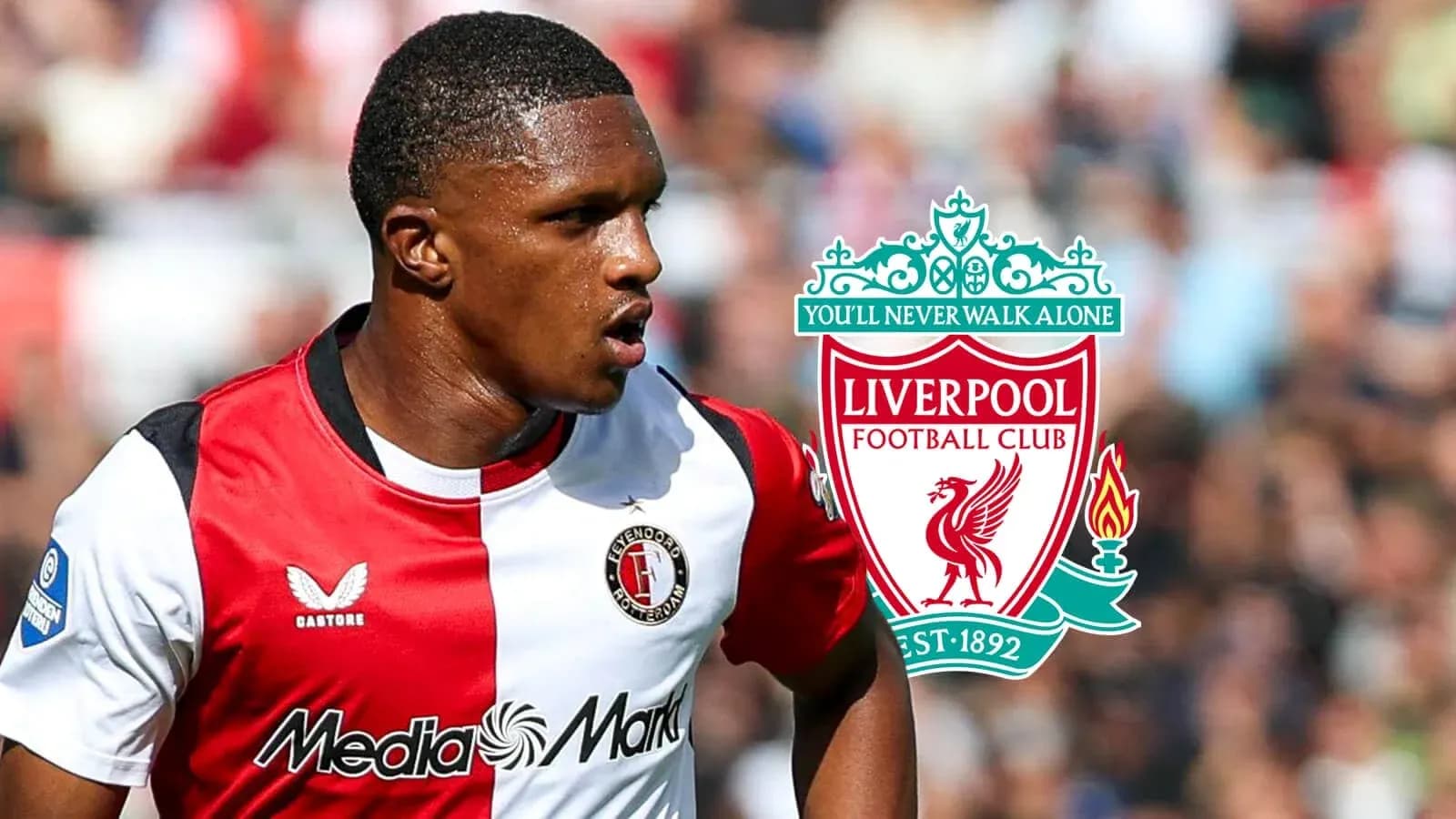 Jugador de Feyenoord con logo de Liverpool detrás Jugador de Feyenoord con logo de Liverpool detrás