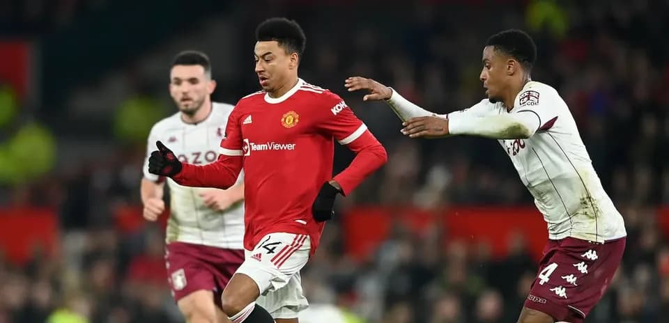 Jesse Lingard dribbling past defender during match