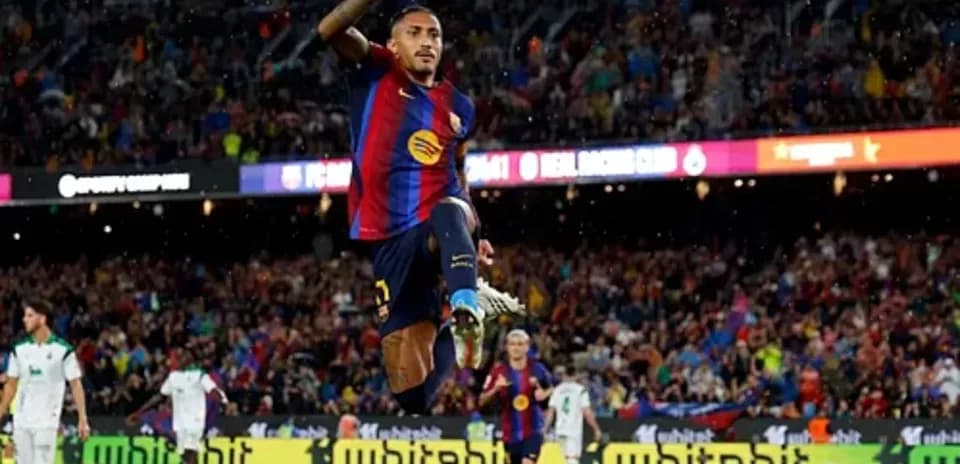 Jugador celebrando un gol en el estadio Camp Nou