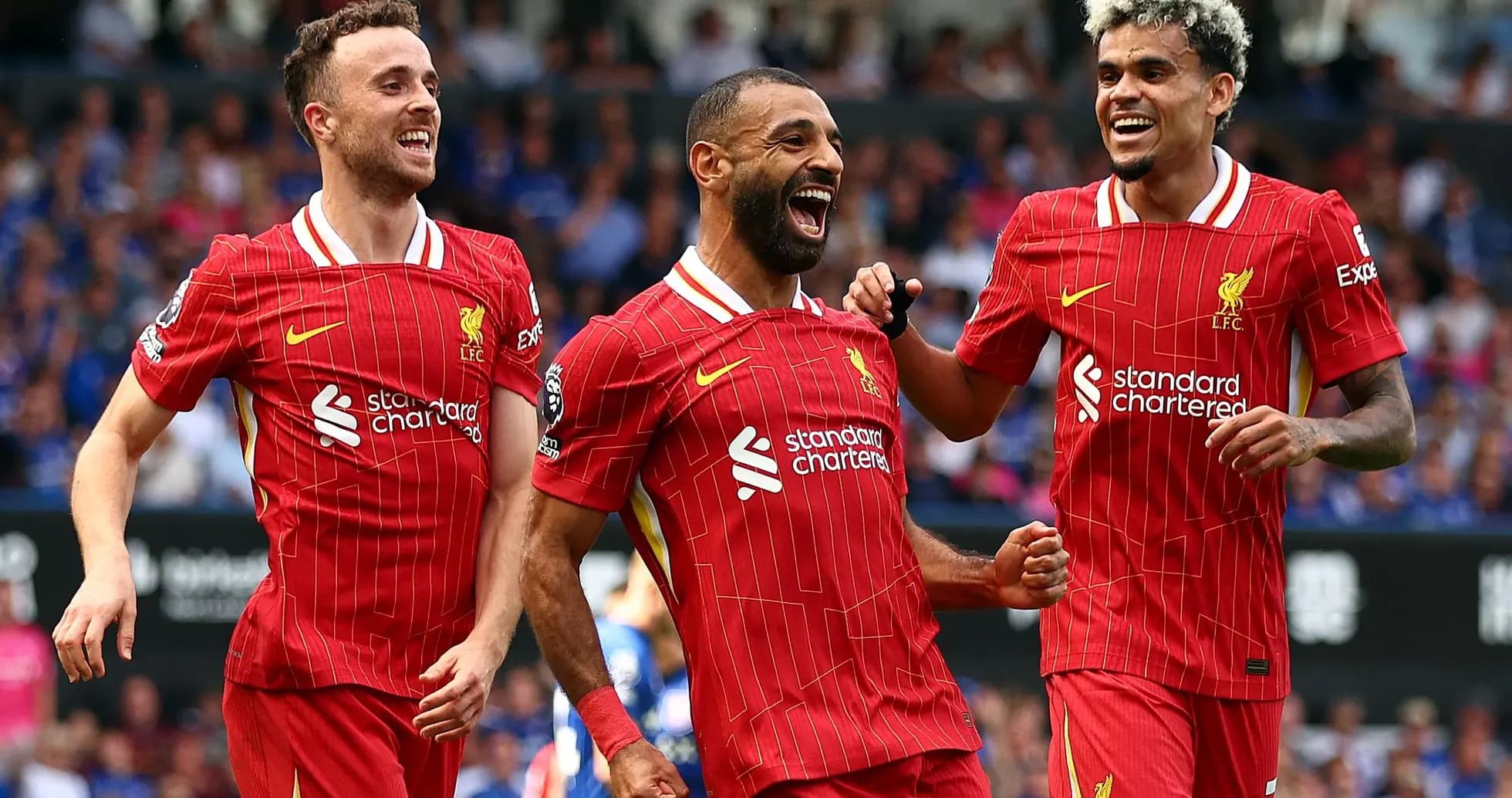 Jugadores de Liverpool celebrando un gol Jugadores de Liverpool celebrando un gol