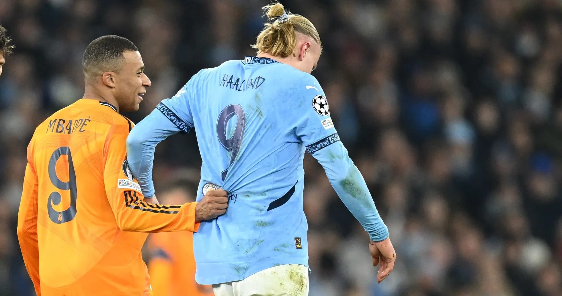 Mbappé pulling Haaland's jersey during match Mbappé pulling Haaland's jersey during match