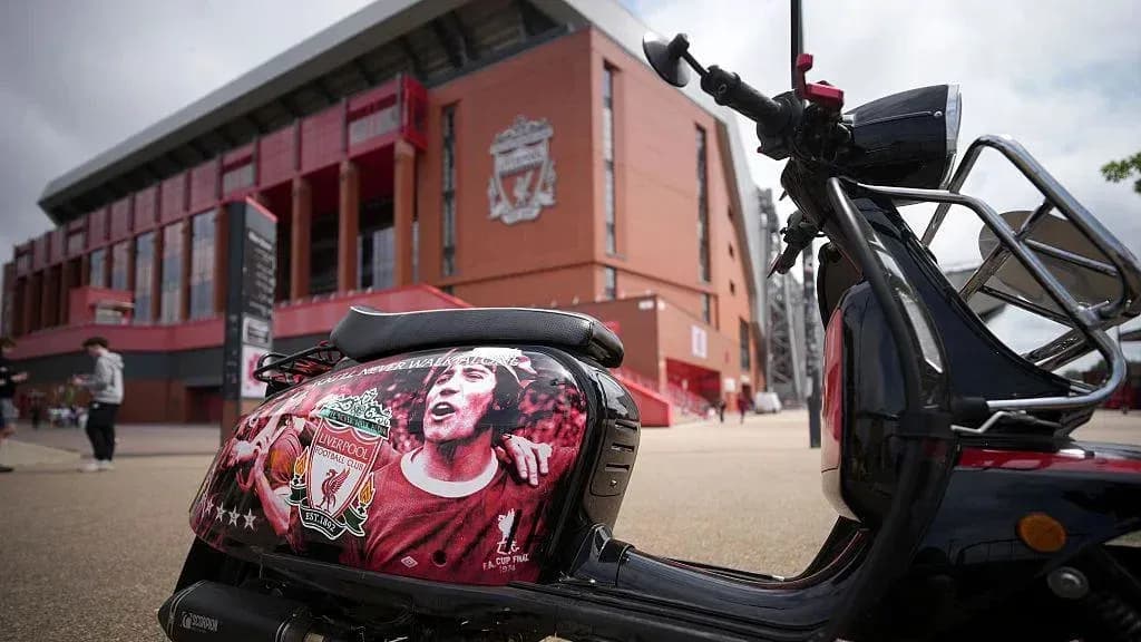 Scooter decorated with Liverpool FC logo outside stadium Scooter decorated with Liverpool FC logo outside stadium